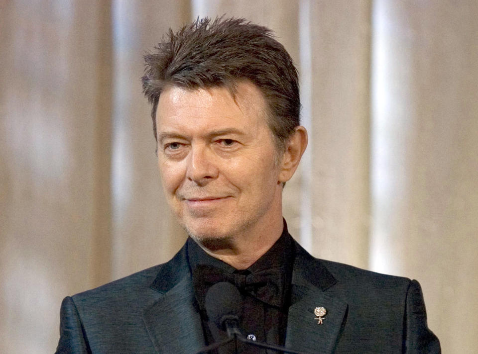 CORRECTS TO STATE THAT ALBUM WAS RELEASED BEFORE HIS DEATH - FILE - In this June 5, 2007 file photo, singer David Bowie accepts the lifetime achievement award at the 11th Annual Webby Awards in New York. Bowie's final album, released days before he died of cancer last year, earned him three Grammy Awards on Sunday, Feb. 12, 2017. (AP Photo/Stephen Chernin, File)
