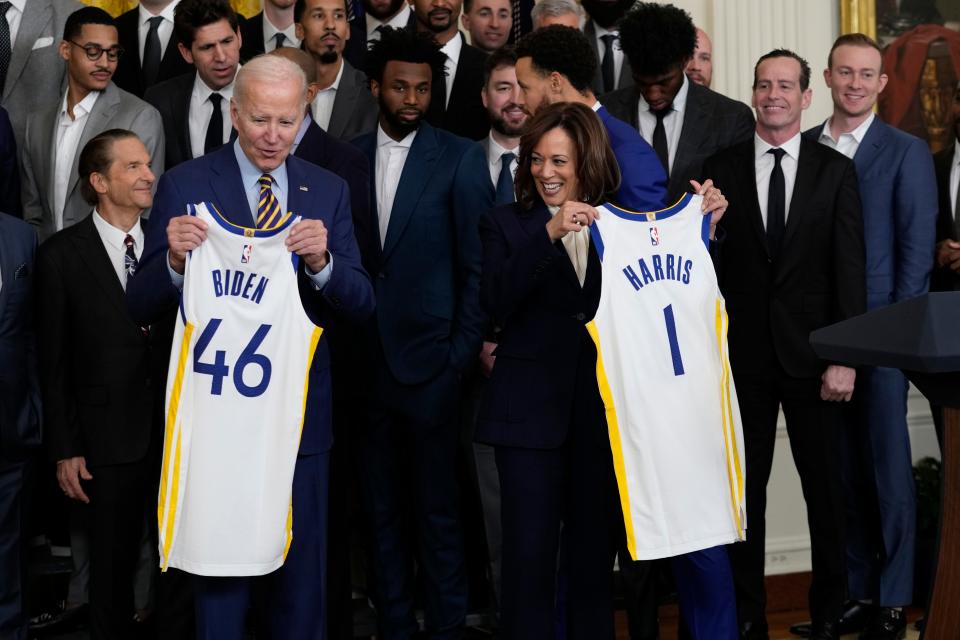 President Joe Biden and Vice President Kamala Harris hold up team jerseys as they welcome the 2022 NBA champions, the Golden State Warriors to the White House.