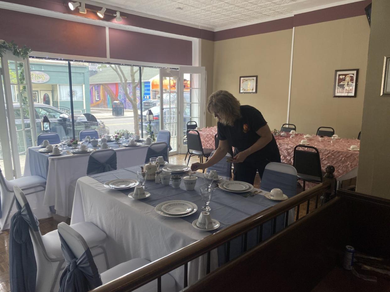 Owner Tammy Carey setting up for an upcoming Mother's Day event at Carey's Brew House, 58 Bridge St., Corning.