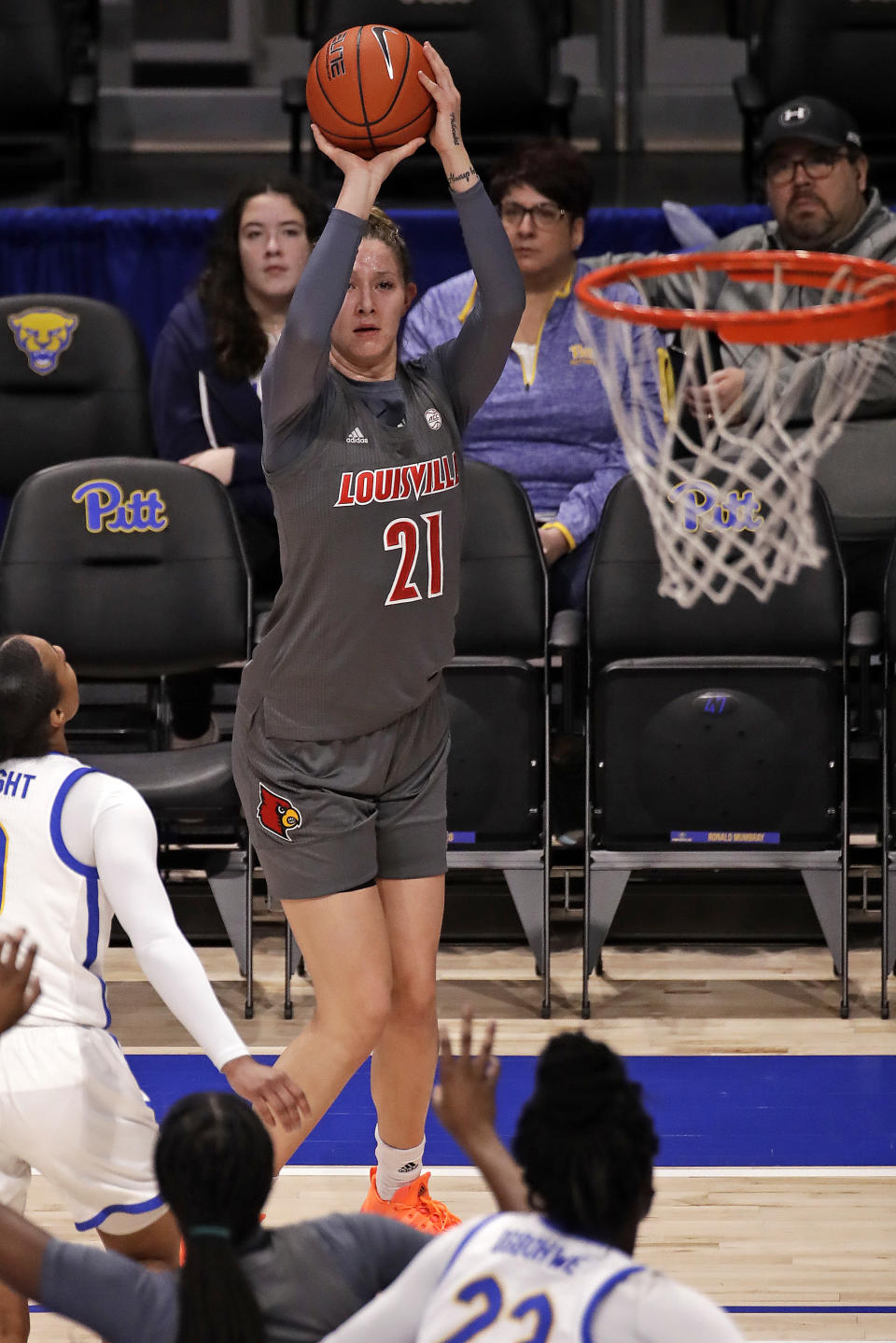 Louisville's Kylee Shook (21) gets off a three-point shot during the first half of an NCAA college basketball game against Pittsburgh in Pittsburgh, Sunday, Feb. 23, 2020. (AP Photo/Gene J. Puskar)