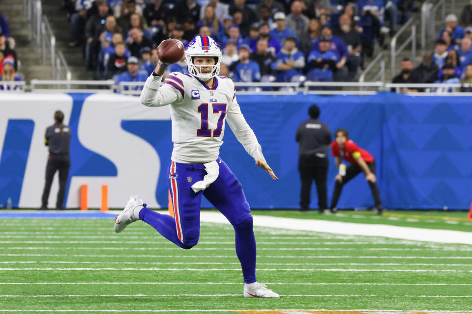 DETROIT, MI - NOVEMBER 24:  Buffalo Bills quarterback Josh Allen (17) looks for a receiver while he scrambles with the ball during a regular season NFL football game between the Buffalo Bills and the Detroit Lions on Thanksgiving Day on November 24, 2022 at Ford Field in Detroit, Michigan.  (Photo by Scott W. Grau/Icon Sportswire via Getty Images)