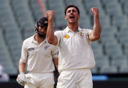 Australia's Mitchell Starc (R) celebrates dismissing New Zealand's Kane Williamson LBW for 22 runs during the first day of the third cricket test match at the Adelaide Oval, in South Australia, November 27, 2015. REUTERS/David Gray