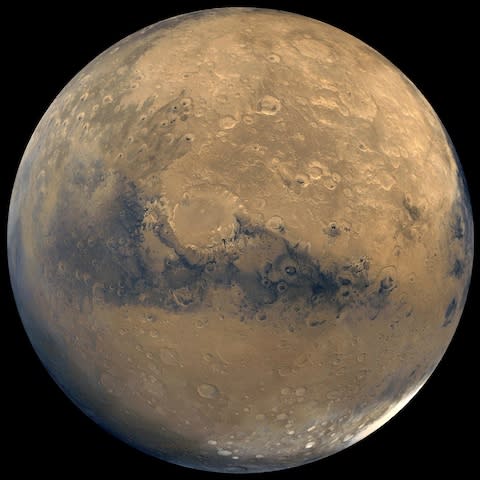 View of Mars stitched together by images taken by Nasa's Viking Orbiter spacecraft - Credit: AP Photo/NASA