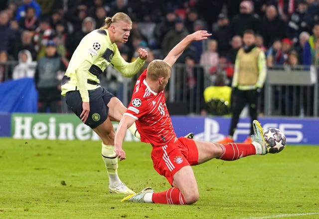 Erling Haaland fires the ball into the net to seal the tie for Manchester City