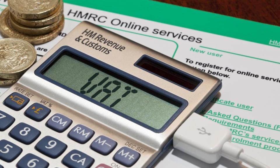 a tax form and a calculator, with the electronic digits spelling out 