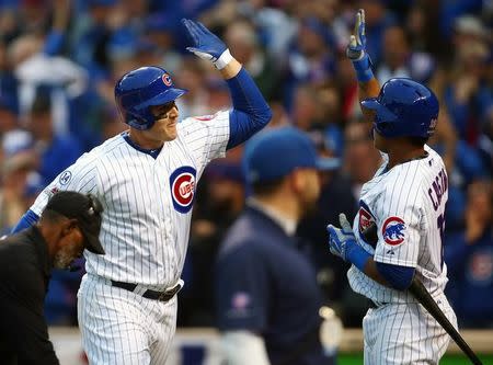 October 13, 2015; Chicago, IL, USA; Chicago Cubs first baseman Anthony Rizzo (44) celebrates with shortstop Starlin Castro (13) his solo home run hit in the sixth inning against St. Louis Cardinals in game four of the NLDS at Wrigley Field. Mandatory Credit: Jerry Lai-USA TODAY Sports