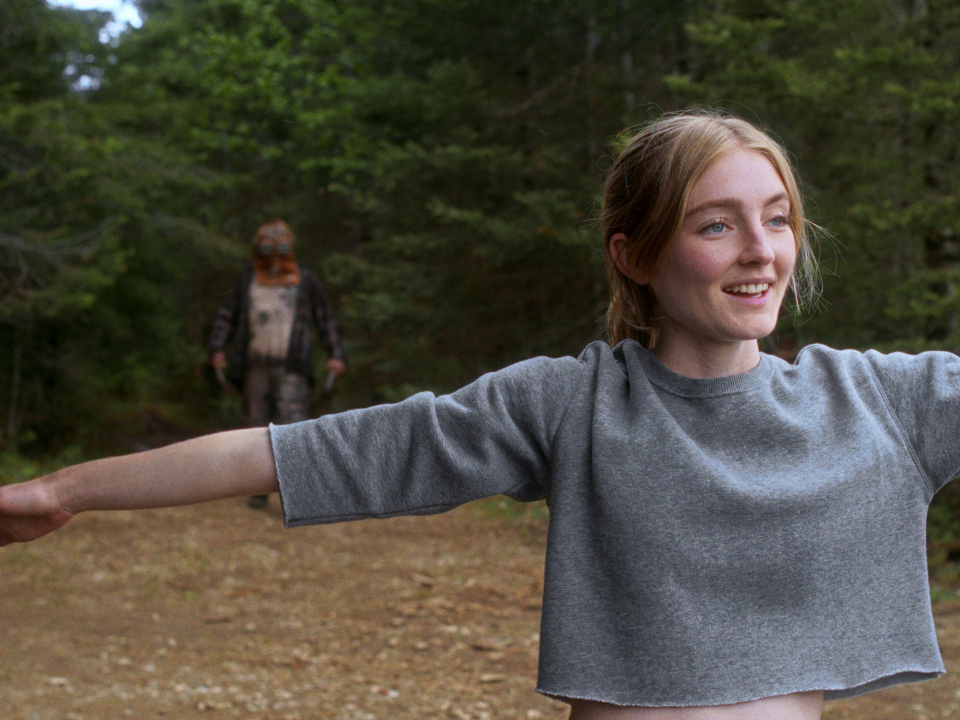 Aurora (Charlotte Creaghan) is just trying to do some yoga when Johnny (Ry Barrett) makes his presence known in "In a Violent Nature."