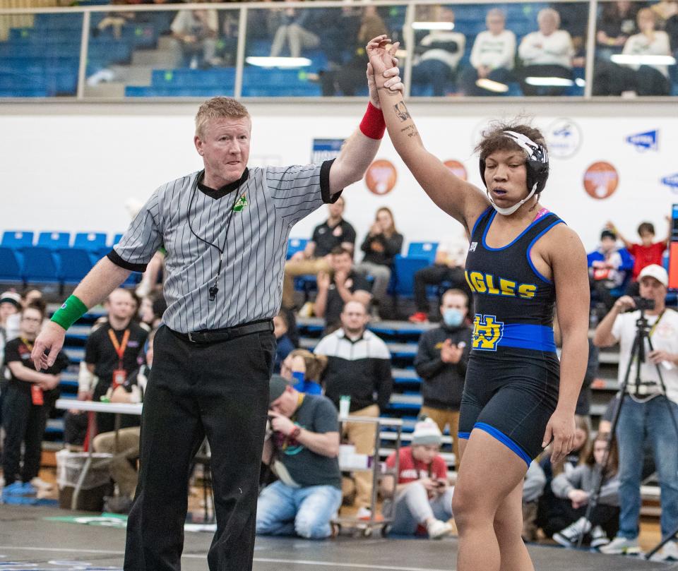 Walnut Hills’ Erin Martin raises her hand after defeating Aubrey Reese of Marysville to win the 155-pound state title Feb. 20, 2022, at Hilliard Davidson.