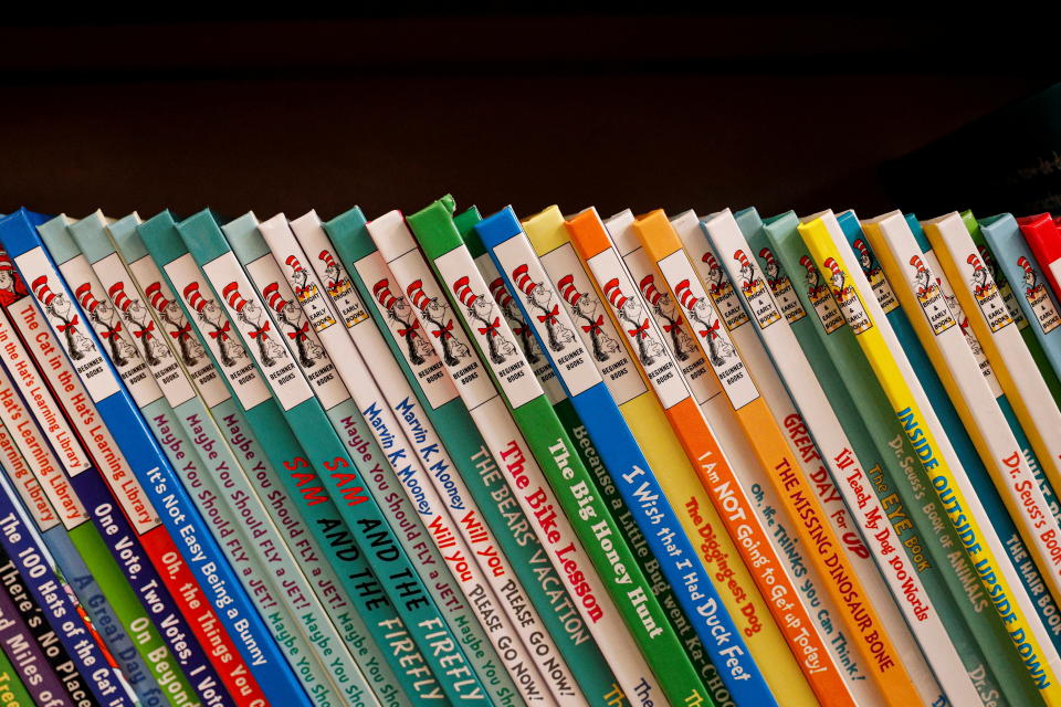 A row of books by Dr. Seuss are displayed in a bookstore.
