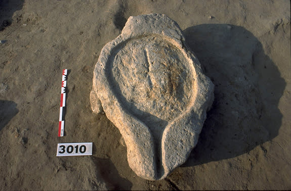 An ancient limestone pressing platform from Lattara, France, dates back to at least 400 B.C. and was used to crush grapes for wine.