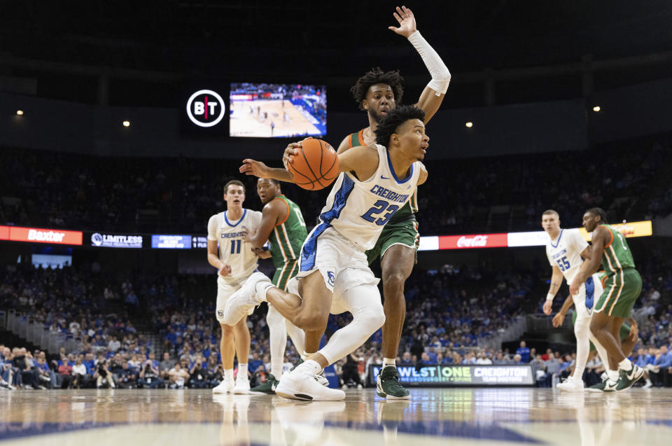 Creighton's Trey Alexander, front, drives against Florida A&M's Keith Lamar during the first half of an NCAA college basketball game on Tuesday, Nov. 7, 2023, in Omaha, Neb. (AP Photo/Rebecca S. Gratz)