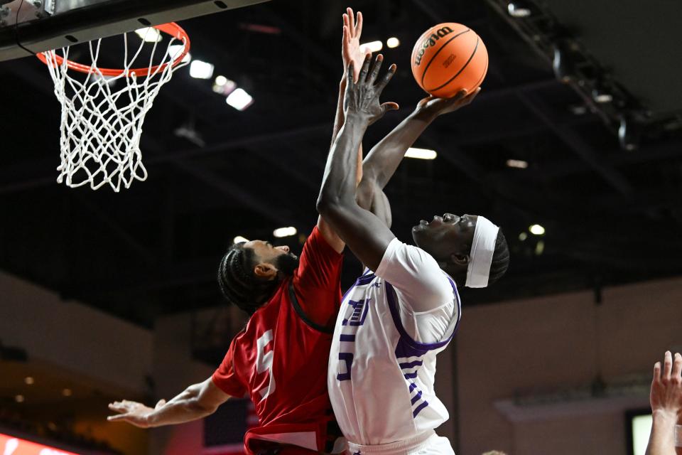 Lok Wur #5 of the Grand Canyon Antelopes shoots against Cameron Tyson #5 of the Seattle Redhawks in the second half of the semifinal game of the Western Athletic Conference basketball tournament at the Orleans Arena on March 15, 2024 in Las Vegas. The Antelopes defeated the Redhawks 80-72.