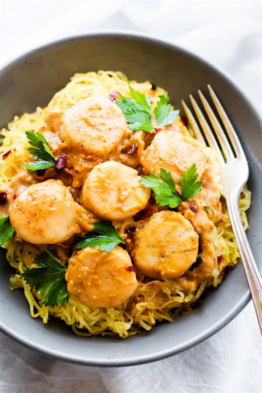<p>Cotter Crunch</p><p>This gluten free seafood pumpkin spaghetti squash pasta is topped with a miso pumpkin sauce and buttery scallops. A healthy lighter version of your favorite pasta dish. </p><p><a href="http://www.cottercrunch.com/seafood-pumpkin-spaghetti-squash-pasta/" rel="nofollow noopener" target="_blank" data-ylk="slk:Get the recipe here!;elm:context_link;itc:0;sec:content-canvas" class="link "><em><strong>Get the recipe here!</strong></em></a></p>