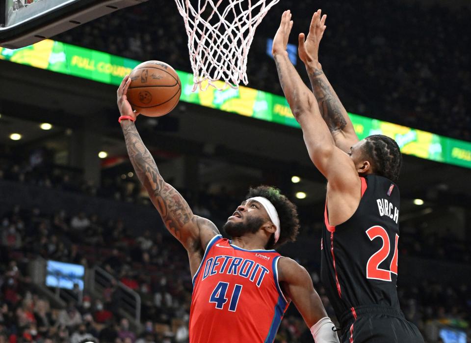Pistons forward Saddiq Bey shoots for a basket past Raptors center Kham Birch during the first half on Thursday, March 3, 2022, in Toronto.