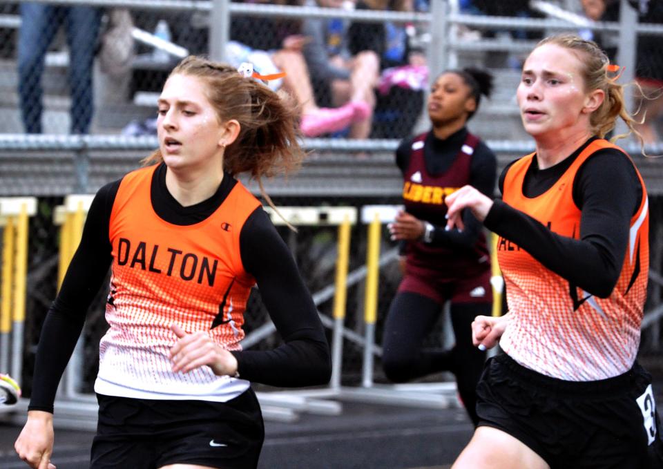 Dalton's Brianna Chenevey and Lauren Clos run the 200-meter dash.