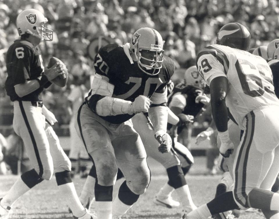 Henry Lawrence (70) was drafted by Oakland Raiders coach John Madden in the first round of the 1974 draft.