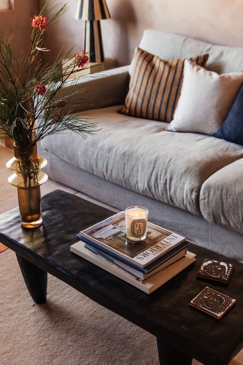 gray sofa and coffee table with books