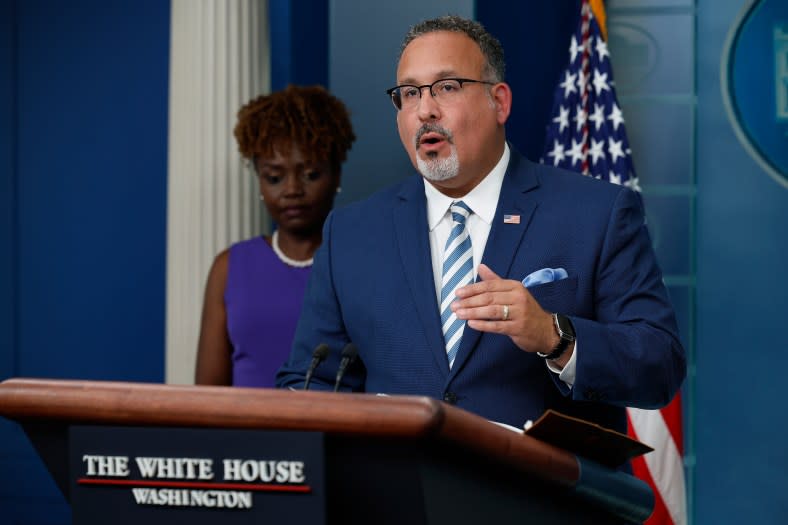 Education Secretary Miguel Cardona (right) said “the Supreme Court got it wrong” on college admissions. Above, he talks to reporters in June about student loan debt as Karine Jean-Pierre (left), the White House press secretary, listens in. (Photo by Chip Somodevilla/Getty Images)