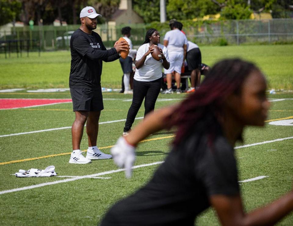 Miami Dolphin’s Tua Tagovailoa runs drills with the girls flag football team during practice after school on Tuesday, July 18, 2023, at Miami Edison Senior High. Gatorade’s Equity in Sports partnered with Tagovailoa and Good Sports to bring the Miami Edison new sporting equipment.