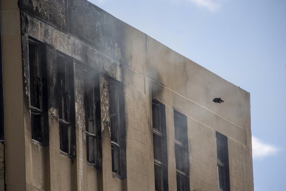 FILE - A drone inspects the damage following a fire near a hostel in central Wellington, New Zealand, on May 16, 2023. New Zealand police on Thursday, June 1, 2023 filed five murder charges against the man they say lit a deadly fire at a Wellington hostel two weeks ago. (Mark Mitchell/NZ Herald via AP, File)