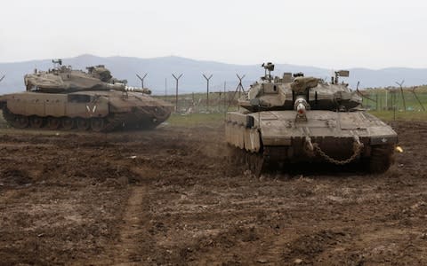 Israeli army Merkava tanks gather in the Israeli-annexed Golan Heights, - Credit: AFP