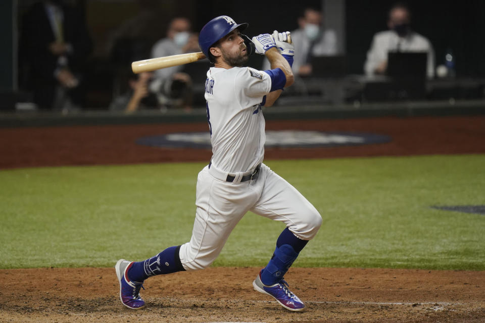 Los Angeles Dodgers' Chris Taylor watches his two-run home run against the Tampa Bay Rays during the fifth inning in Game 2 of the baseball World Series Wednesday, Oct. 21, 2020, in Arlington, Texas. (AP Photo/Eric Gay)