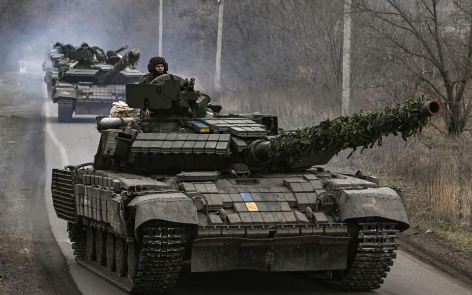 Ukrainian T64 tanks move towards Bakhmut direction, in Donetsk Oblast region - ARIS MESSINIS/AFP