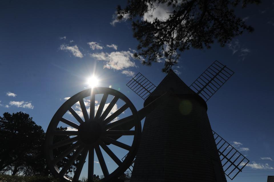 The late morning sun fills the sky over the Godfrey Windmill in Chatham. Cape Cod Times/Merrily Cassidy