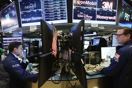 Traders work on the floor of the New York Stock Exchange (NYSE) shortly after the opening bell in New York, U.S., October 17, 2016. REUTERS/Lucas Jackson