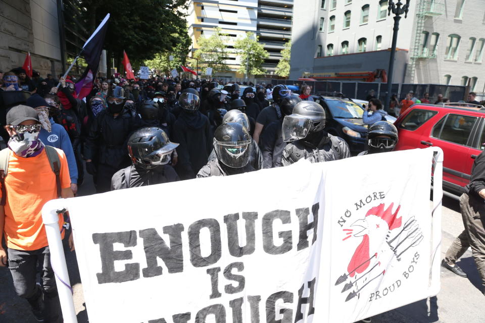 Multiple groups, including Rose City Antifa, the Proud Boys and conservative activist Haley Adams protest in downtown Portland, Ore., Saturday, June 29, 2019. (Dave Killen/The Oregonian via AP)