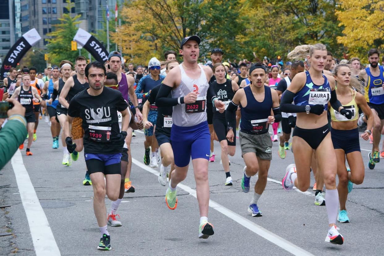 Some 5,000 runners are expected to race in the 2023 Toronto Waterfront Marathon. (Alex Lupul/The Canadian Press - image credit)