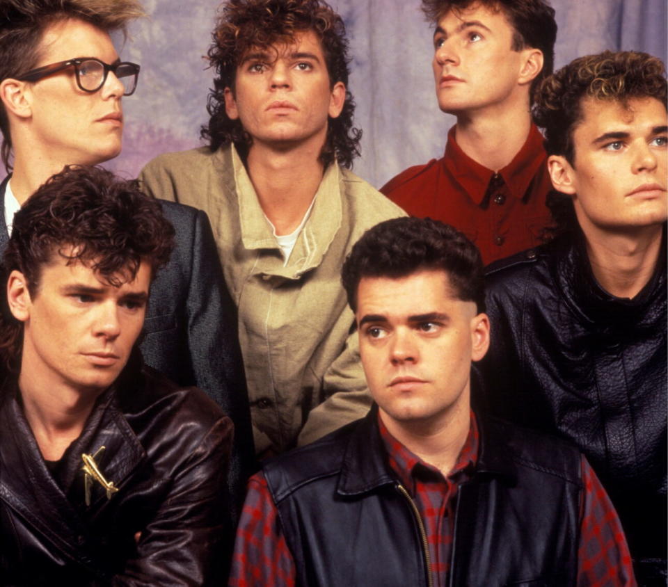 INXS in London in 1983. (back) Kirk Pengilly, Michael Hutchence, Jon Farriss, Garry Gary Beers (front) Tim Farriss, Andrew Farriss. (Credit: Michael Putland/Getty Images)