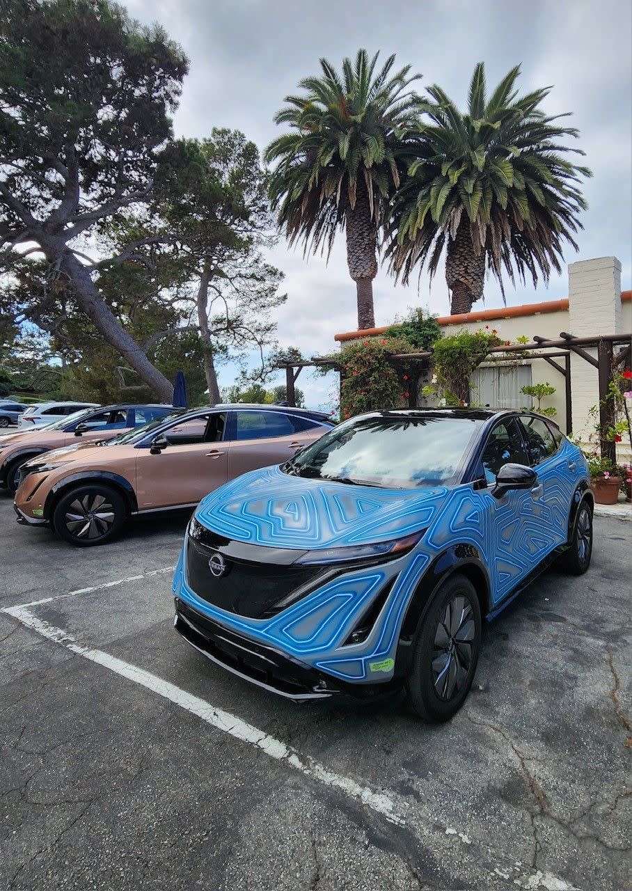 a blue car parked in a parking lot