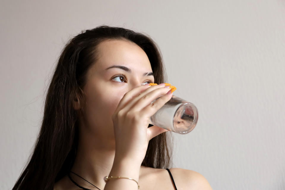 girl drinking energy drink 