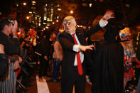 <p>A man wearing a President Trump mask walks like a zombie at the 44th annual Village Halloween Parade in New York City on Oct. 31, 2017. (Photo: Gordon Donovan/Yahoo News) </p>