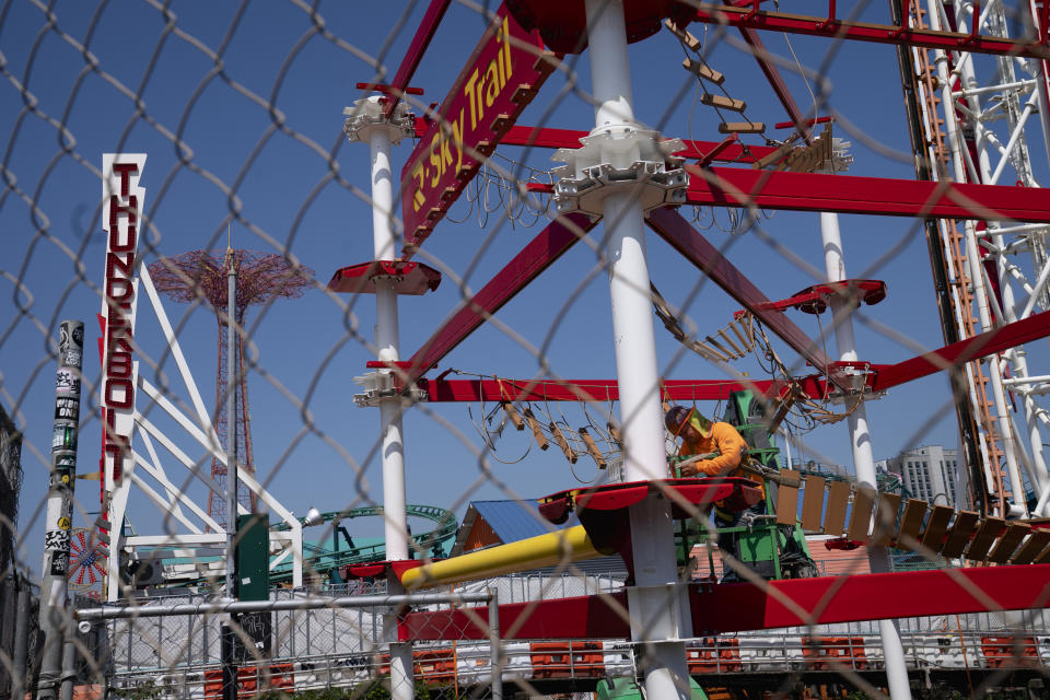 Construction is underway in the amusement park district of Coney Island, Friday, June 17, 2022, in the Brooklyn borough of New York. Luna Park in Coney Island will open three new major attractions this season alongside new recreational areas and pedestrian plazas. (AP Photo/John Minchillo)