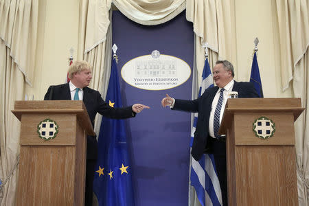 British Foreign Secretary Boris Johnson and Greek Foreign Minister Nikos Kotzias gesture to each other during a press conference, following their meeting at the Foreign Ministry in Athens, Greece, April 6, 2017. REUTERS/Alkis Konstantinidis