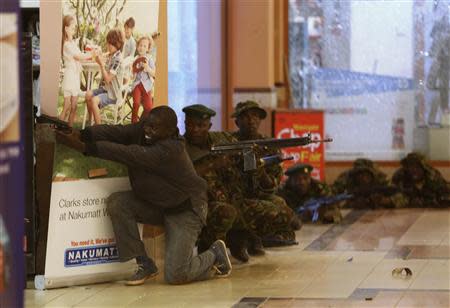 Soldiers and armed police hunt gunmen who went on a shooting spree in Westgate shopping centre in Nairobi