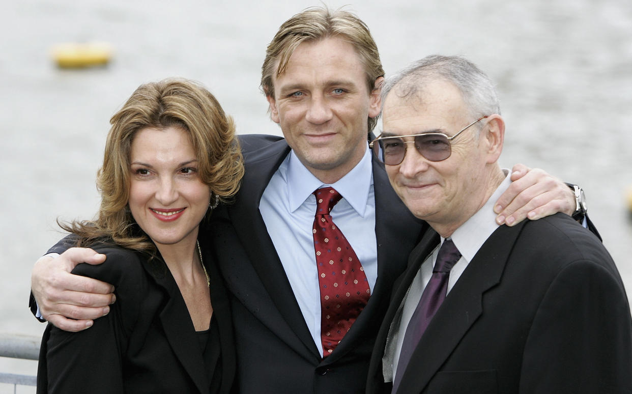 LONDON - OCTOBER 14:  Actor Daniel Craig (C) poses with Barbara Broccoli (L) and Michael G Wilson (R) as he is unveiled as the new actor to play the legendary British secret agent James Bond 007 in the 21st Bond film Casino Royale, at HMS President, St Katharine's Way on October 14, 2005 in London, England. Speculation as to who might replace Pierce Brosnan (who played Bond from 1995-2002) has been fierce, with Clive Owen, Jude Law, Ewan McGregor, Colin Salmon, Colin Farrell and Goran Visnjic in the running, but the most likely candidates were whittled down to Craig and Henry Cavill until today's decision.  (Photo by Chris Jackson/Getty Images)