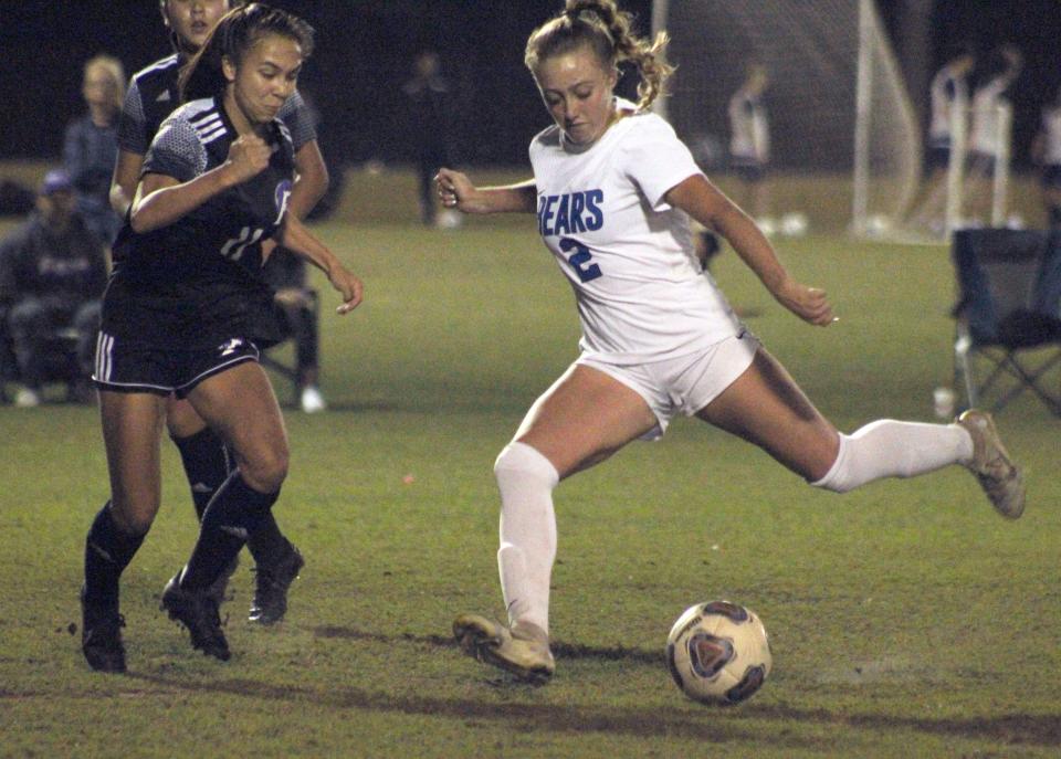 Bartram Trail midfielder Grace Ivey (2) lines up a shot as Fletcher midfielder Allison Aquino (11) defends during a high school girls soccer game on November 8, 2022. [Clayton Freeman/Florida Times-Union]