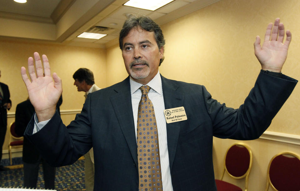 FILE - Former major league baseball player Rafael Palmeiro speaks about his legacy as a ball player following 20 years in the majors at a reception before his induction into the Mississippi Sports Hall of Fame, Friday night, July 27, 2012, in Jackson, Miss. Steroids-tainted stars Barry Bonds, Roger Clemens and Rafael Palmeiro are on the eight-man ballot for the Hall of Fame’s contemporary baseball era committee, which meets Sept. 4 in San Diego.(AP Photo/Rogelio V. Solis, File)