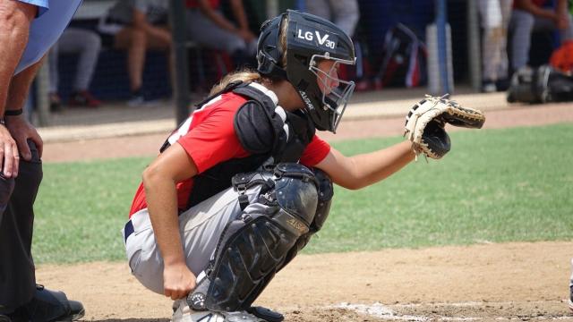 a woman with a baseball for a head - Playground