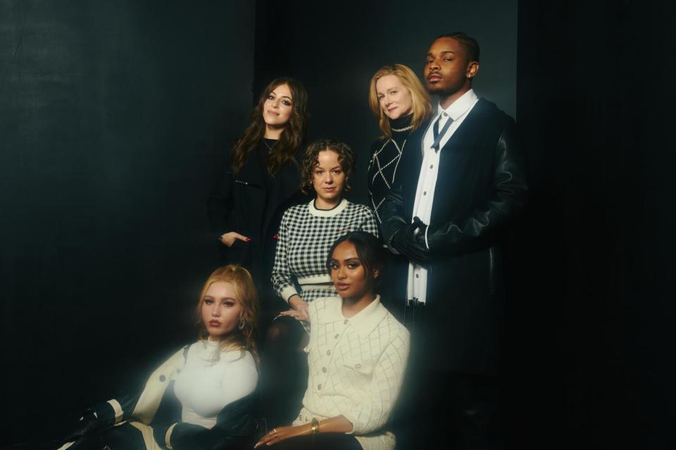 Six people pose for a portrait.