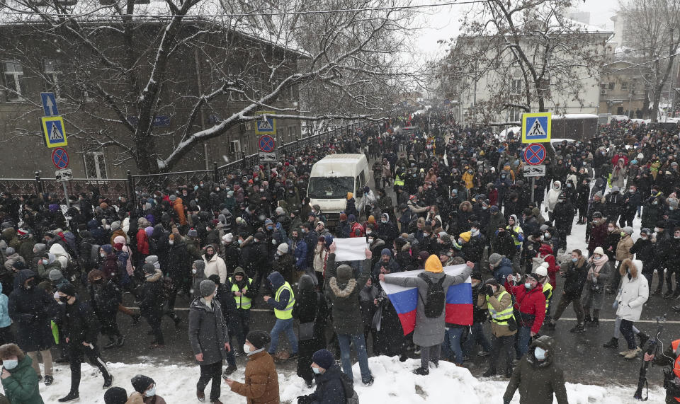 People attend a protest against the jailing of opposition leader Alexei Navalny in Moscow, Russia, Sunday, Jan. 31, 2021. Thousands of people have taken to the streets across Russia to demand the release of jailed opposition leader Alexei Navalny, keeping up the wave of nationwide protests that have rattled the Kremlin. Hundreds have been detained by police. (AP Photo/Andrew Lubimov)