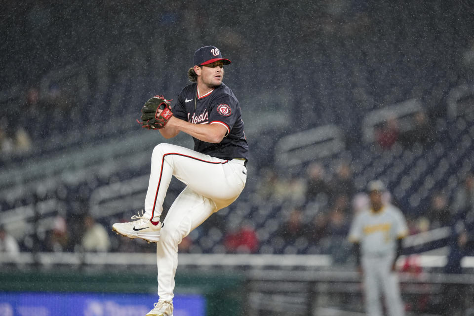 Washington Nationals relief pitcher Kyle Finnegan throws in the rain during the ninth inning of a baseball game against the Pittsburgh Pirates at Nationals Park, Wednesday, April 3, 2024, in Washington. The Nationals won 5-3. (AP Photo/Alex Brandon)