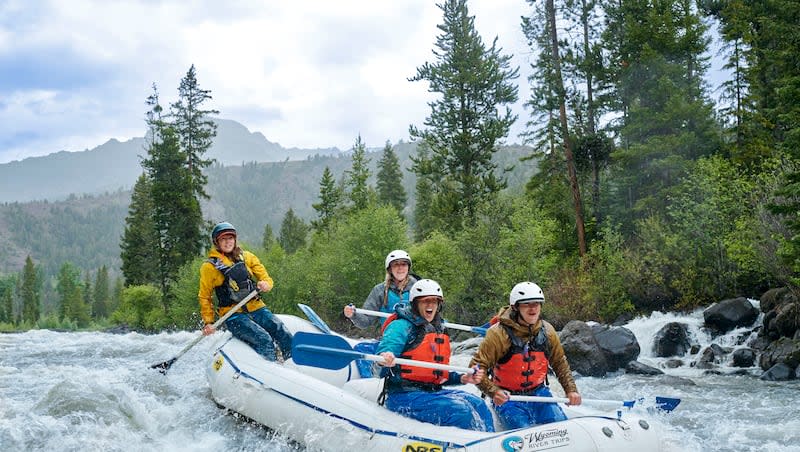 A group of white water rafters shoot the rapids on the North Fork Shoshone River in June 2023.