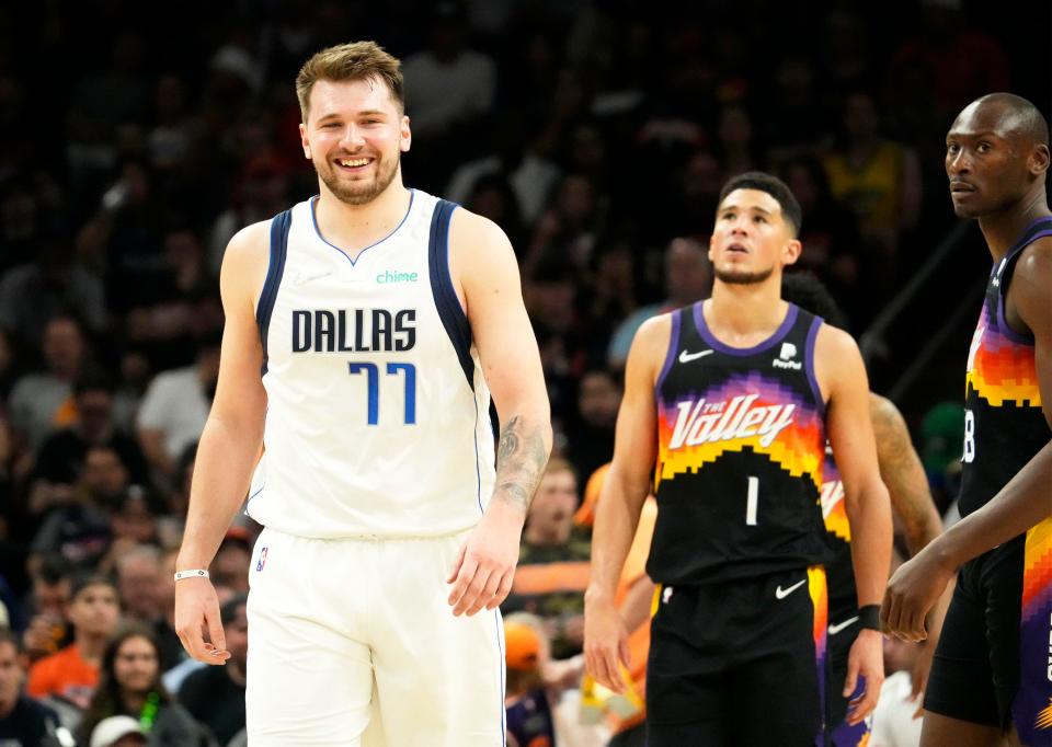 May 15, 2022; Phoenix, Arizona, USA; Dallas Mavericks guard Luka Doncic (77) smiles during the third quarter against the Phoenix Suns during game seven of the second round for the 2022 NBA playoffs at Footprint Center.