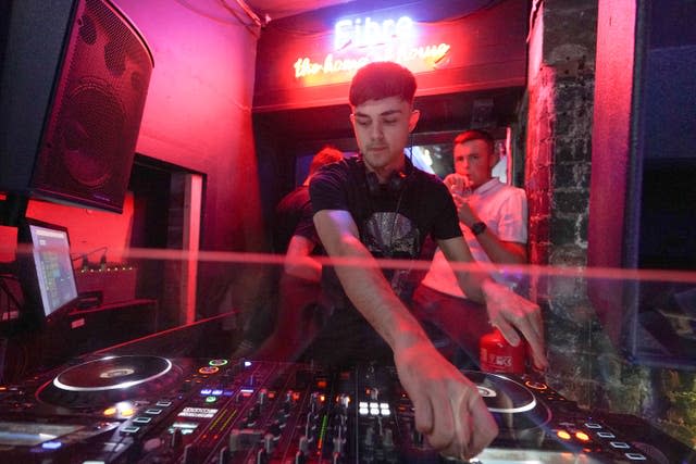 A DJ playing music in Bar Fibre in Leeds