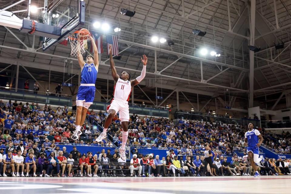 Kentucky’s Reed Sheppard beats Canada’s Jahmyl Telfort to the basket for a first-half dunk during the Wildcats’ game in the GLOBL JAM in Toronto on Thursday night. Sheppard converted a steal and a blocked shot into breakaway slams during the opening 20 minutes.