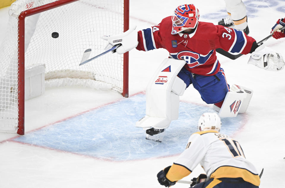 Nashville Predators' Colton Sissons (10) scores against Montreal Canadiens goaltender Jake Allen during the second period of an NHL hockey game in Montreal, Sunday, Dec. 10, 2023. (Graham Hughes/The Canadian Press via AP)